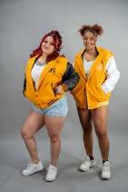 Classic Varsity Jacket 50 Two models wearing Reign Gear women's yellow and black water-repellent hooded varsity jackets
