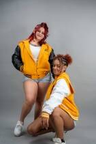 Classic Varsity Jacket 48 Two models wearing Reign Gear women's classic varsity jackets in multiple colorways