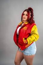 Classic Nylon Jacket 9 Reign Gear women's red and yellow water-repellent hooded varsity jacket.