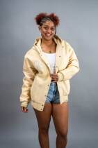 Classic Varsity Jacket 21 Reign Gear women's water-repellent hooded varsity jacket in cream.