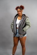 Classic Varsity Jacket 12 Reign Gear women's gray and olive water-repellent hooded varsity jacket.