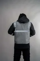 Industrial Work Jacket 12 Model wearing the Reign Gear gray industrial work jacket with reflective detailing