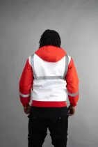 Industrial Work Jacket 15 Model wearing a Reign Gear reflective safety vest over a red hoodie