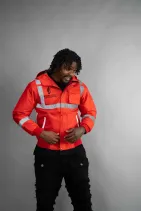 Industrial Work Jacket 13 Model wearing the Reign Gear red industrial work jacket with reflective detailing