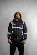 Industrial Work Jacket 2 Model wearing the Reign Gear black reflective industrial work jacket