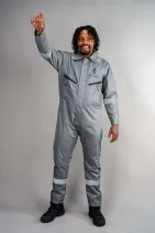 Water-Repellent Coveralls | Industrial Workwear by Reign Gear LLC 3 Model wearing Reign Gear gray water-repellent reflective work coveralls