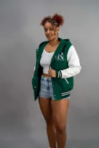 Classic Varsity Jacket 39 Reign Gear women's green and white water-repellent hooded varsity jacket.