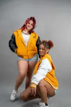 Classic Varsity Jacket 48 Two models wearing Reign Gear women's classic varsity jackets in multiple colorways