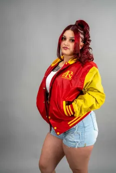 Classic Nylon Jacket 9 Reign Gear women's red and yellow water-repellent hooded varsity jacket.