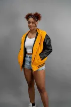 Zipper Varsity Jacket 6 Reign Gear women's orange and black water-repellent varsity jacket.