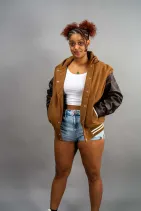 Classic Varsity Jacket 2 Reign Gear women's brown and black water-repellent hooded varsity jacket.